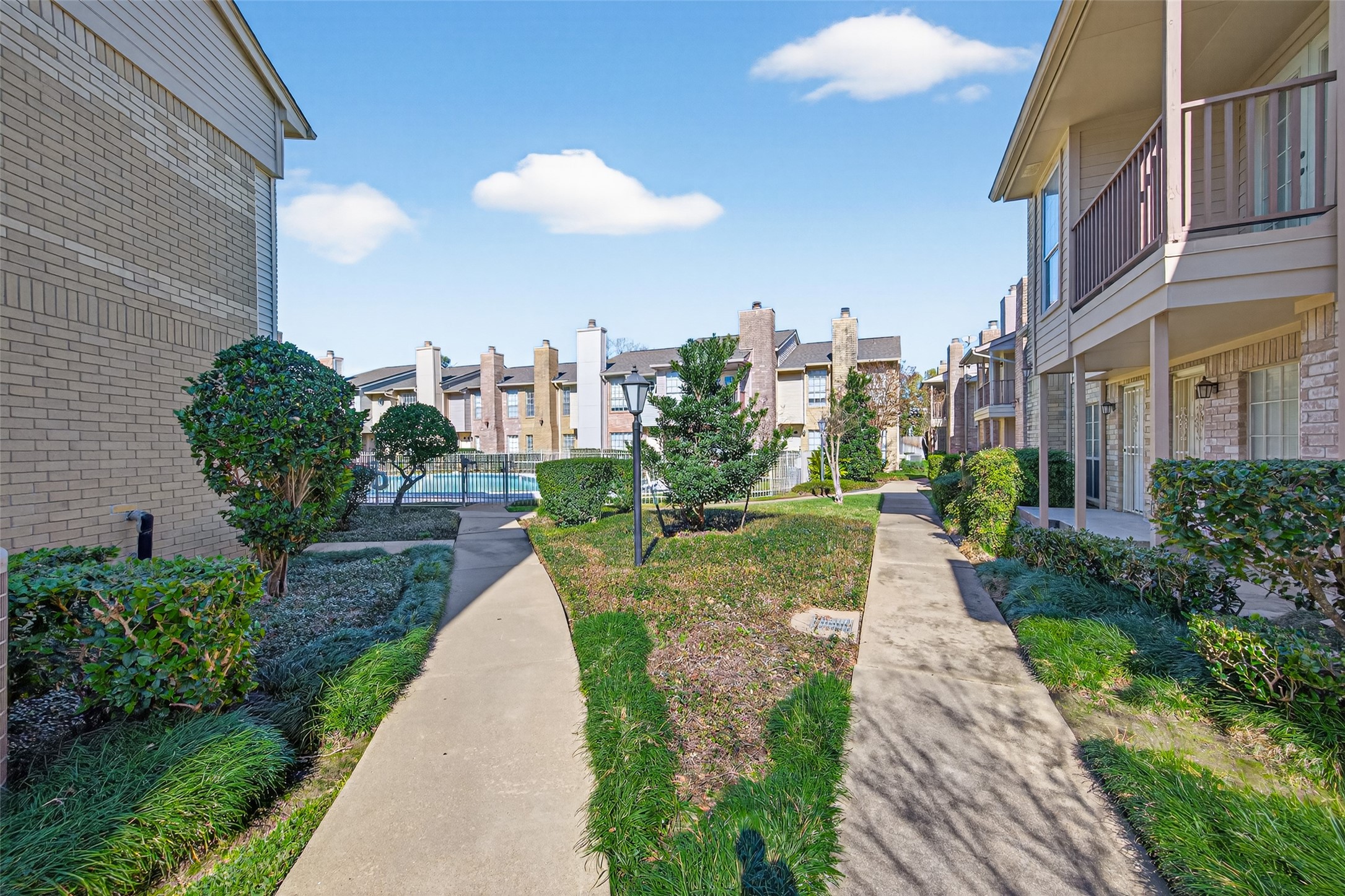 3100 Jeanetta Street, Unit 1004 Houston, TX 77063 - Photo 38 of 42 The community grounds are a tapestry of deep greens and manicured paths, offering a quiet escape from the hustle of the Galleria area.