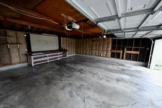 a view of an empty room with wooden walls