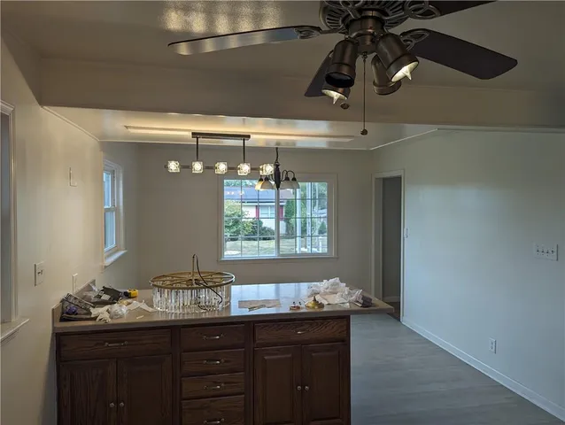 a bathroom with a granite countertop sink a vanity and window