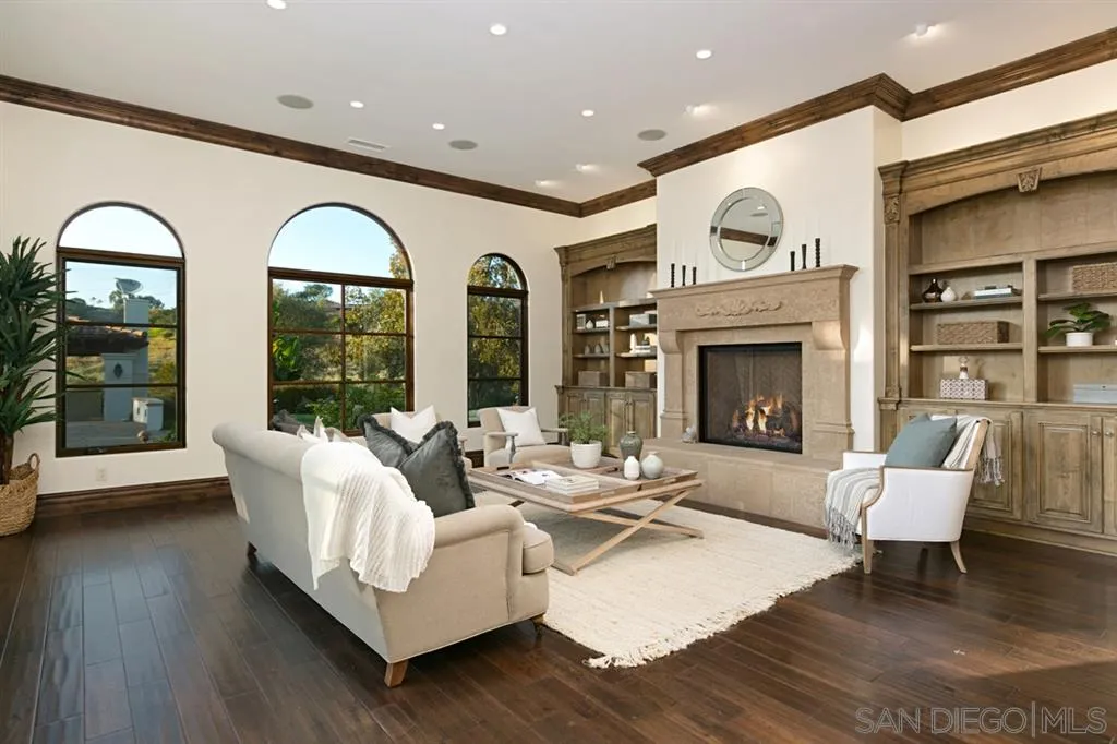 7620 Iluminado San Diego, CA 92127 - Photo 12 of 25 a living room with furniture and a fireplace