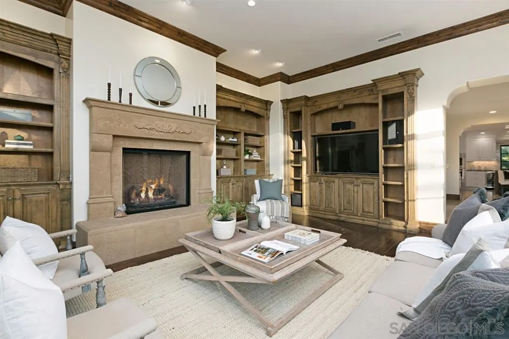 7620 Iluminado San Diego, CA 92127 - Photo 13 of 25 a living room with furniture and a fireplace