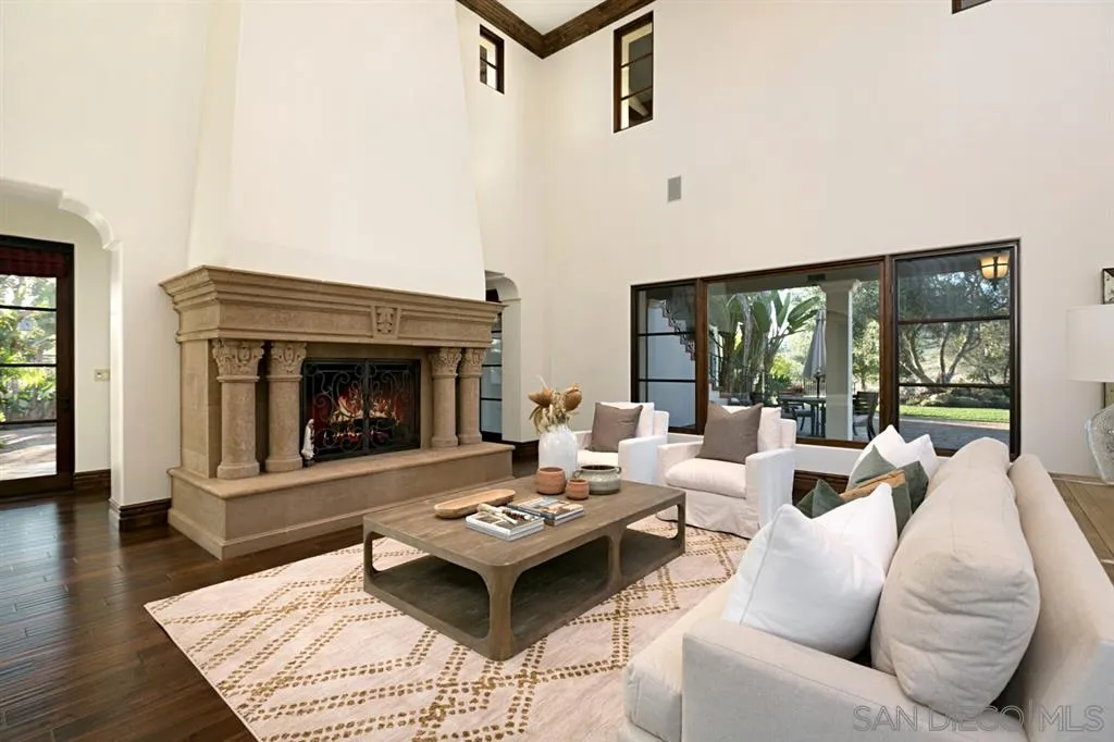 7620 Iluminado San Diego, CA 92127 - Photo 4 of 25 a living room with furniture and a fireplace