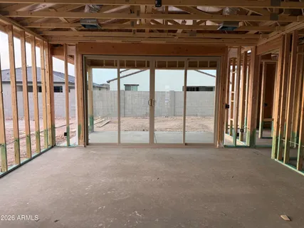 a view of empty room with floor to ceiling window