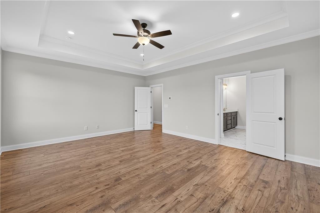 3787 Cheyenne Lane Jefferson, GA 30549 - Photo 42 of 82 a view of empty room with wooden floor and ceiling fan