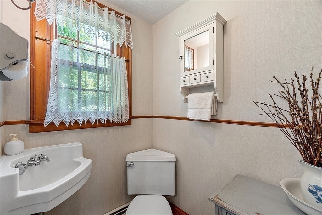 15 Osgood Road Sterling, MA 01564 - Photo 16 of 31 a bathroom with a toilet sink and mirror