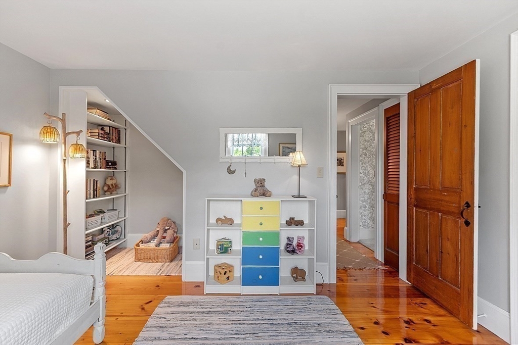 15 Osgood Road Sterling, MA 01564 - Photo 20 of 31 a bedroom with a bed and wooden floor