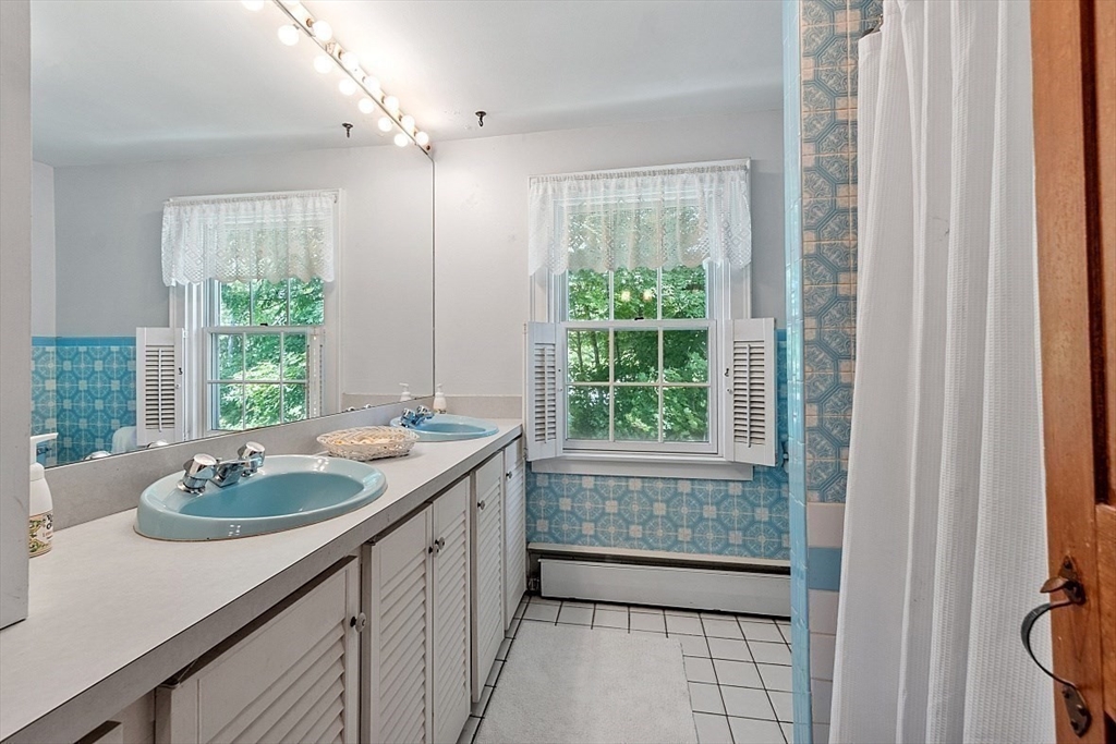 15 Osgood Road Sterling, MA 01564 - Photo 21 of 31 a bathroom with a sink and a window