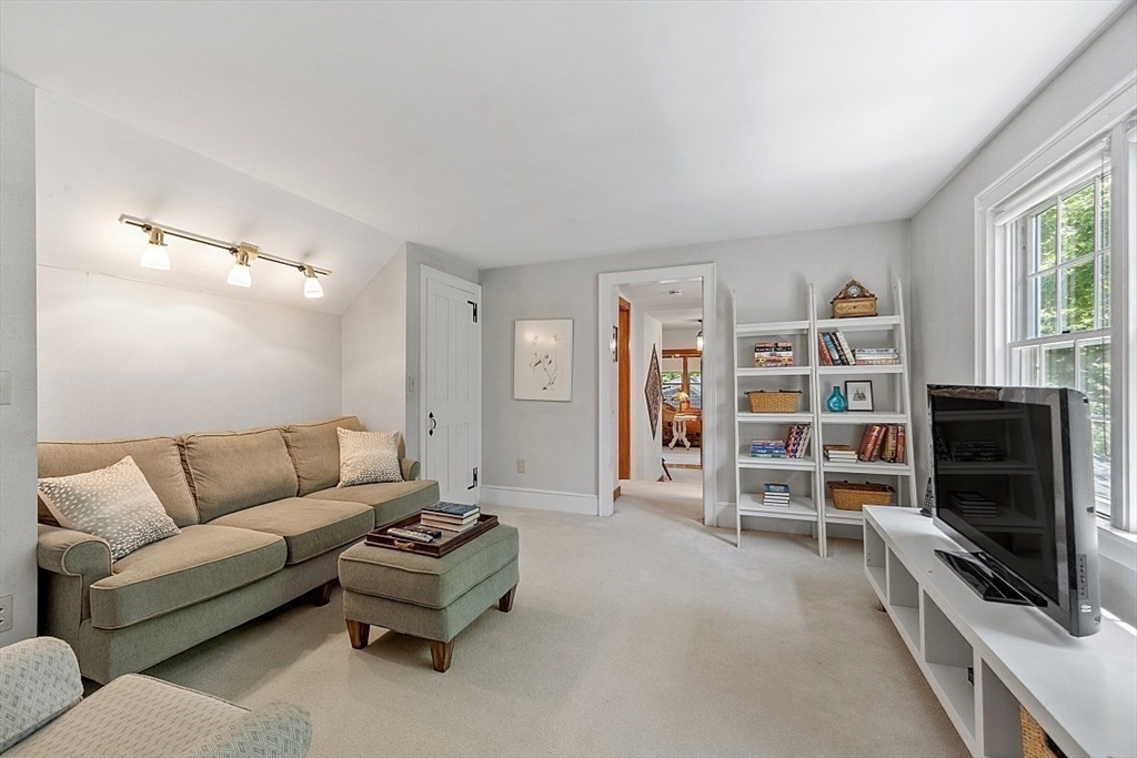 15 Osgood Road Sterling, MA 01564 - Photo 22 of 31 a living room with furniture and a flat screen tv