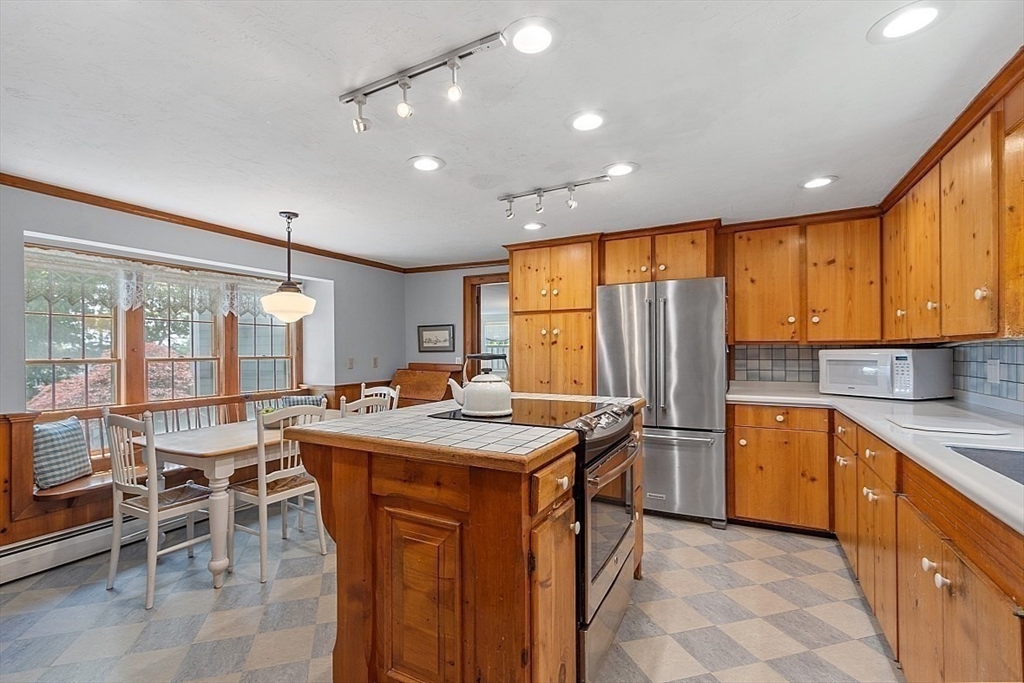 15 Osgood Road Sterling, MA 01564 - Photo 8 of 31 a kitchen with stainless steel appliances granite countertop table chairs sink and cabinets