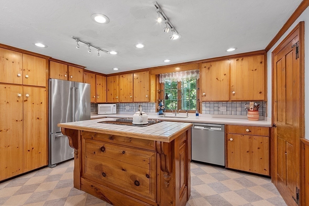 15 Osgood Road Sterling, MA 01564 - Photo 9 of 31 a kitchen with stainless steel appliances granite countertop sink stove and refrigerator