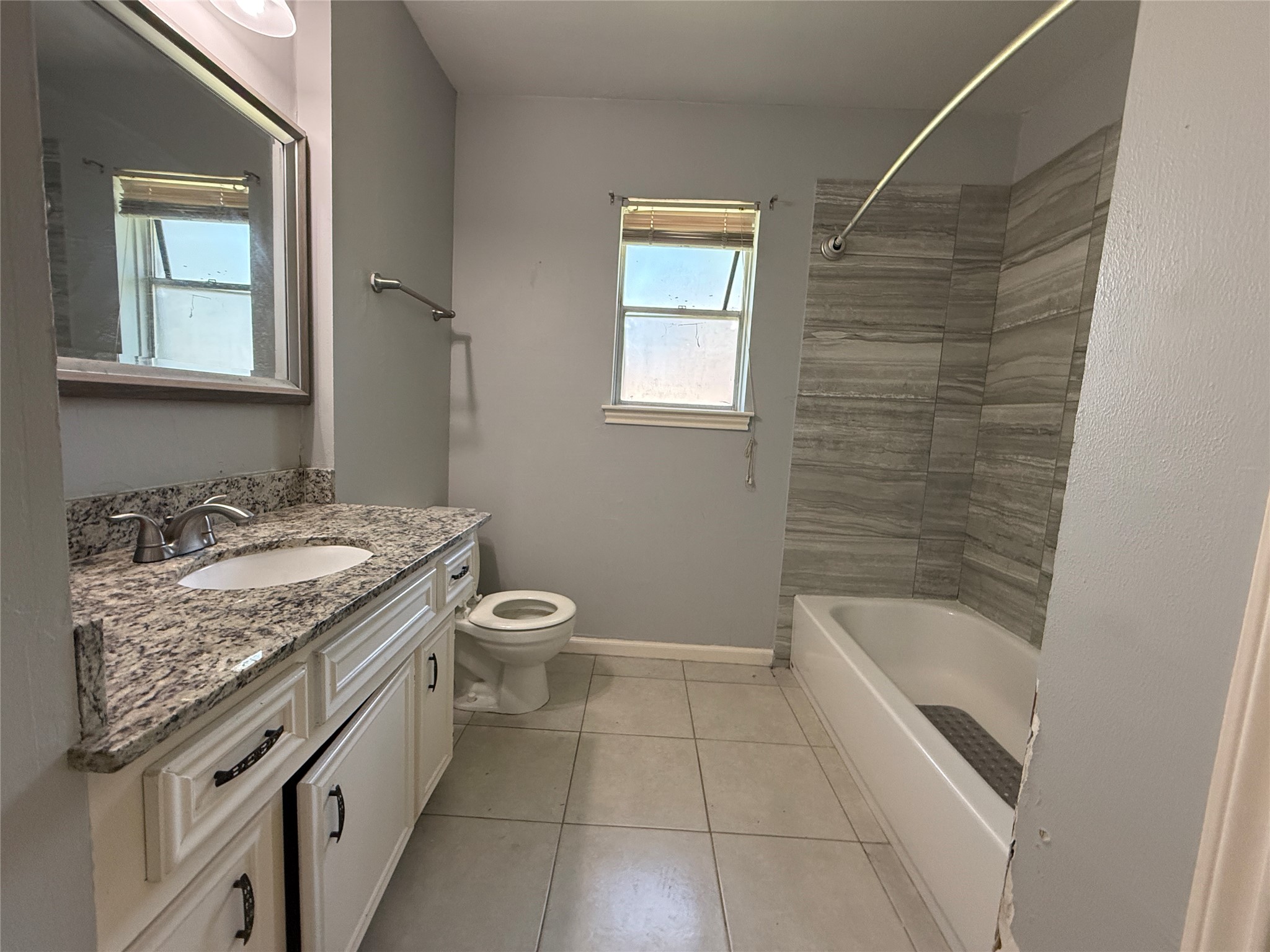 422 Gamewood Drive Spring, TX 77386 - Photo 20 of 25 a bathroom with a granite countertop sink a toilet and bathtub