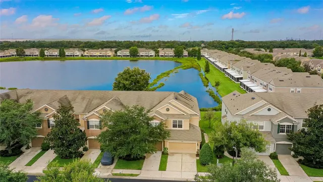 an aerial view of a house with a lake view