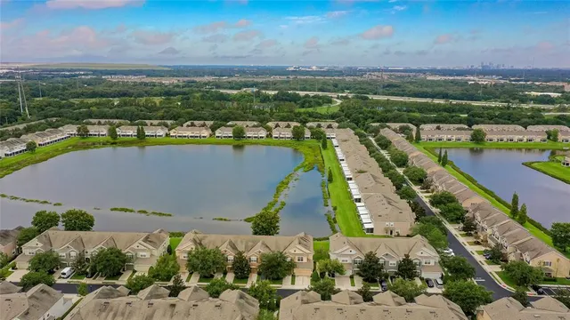 an aerial view of a city with a lake view