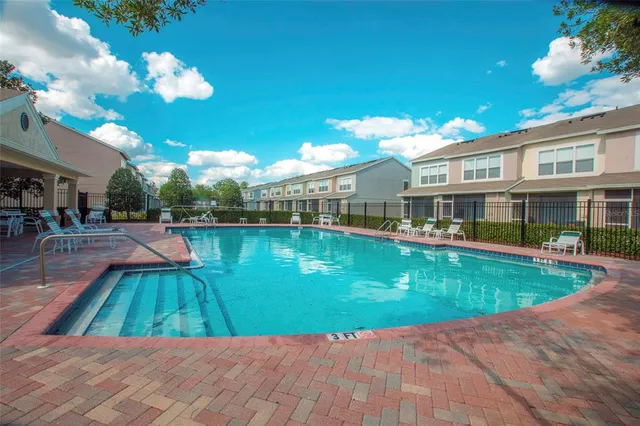a view of a swimming pool with a patio