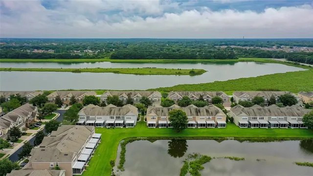 an aerial view of a house with a garden and deck