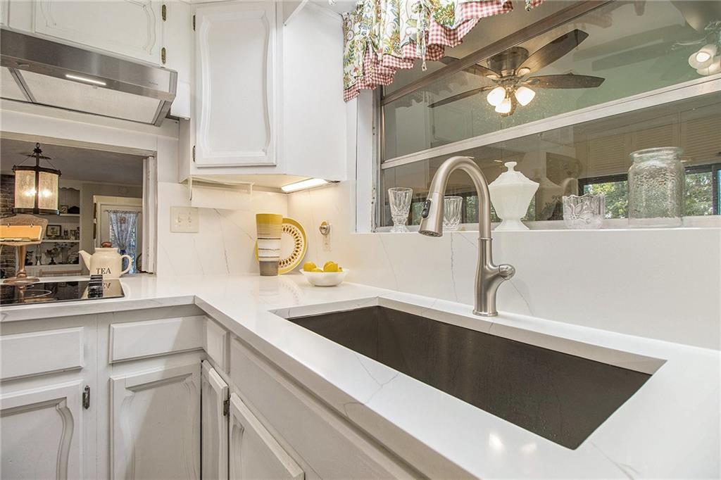 111 Lewis Drive Southeast Calhoun, GA 30701 - Photo 11 of 53 a kitchen with a sink and cabinets