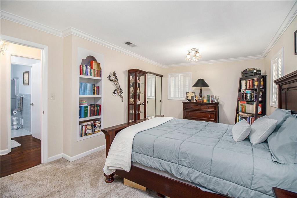 111 Lewis Drive Southeast Calhoun, GA 30701 - Photo 23 of 53 a bedroom with a bed and a book shelf