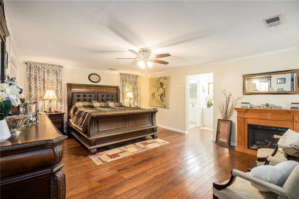 111 Lewis Drive Southeast Calhoun, GA 30701 - Photo 26 of 53 a bedroom with furniture and a fireplace