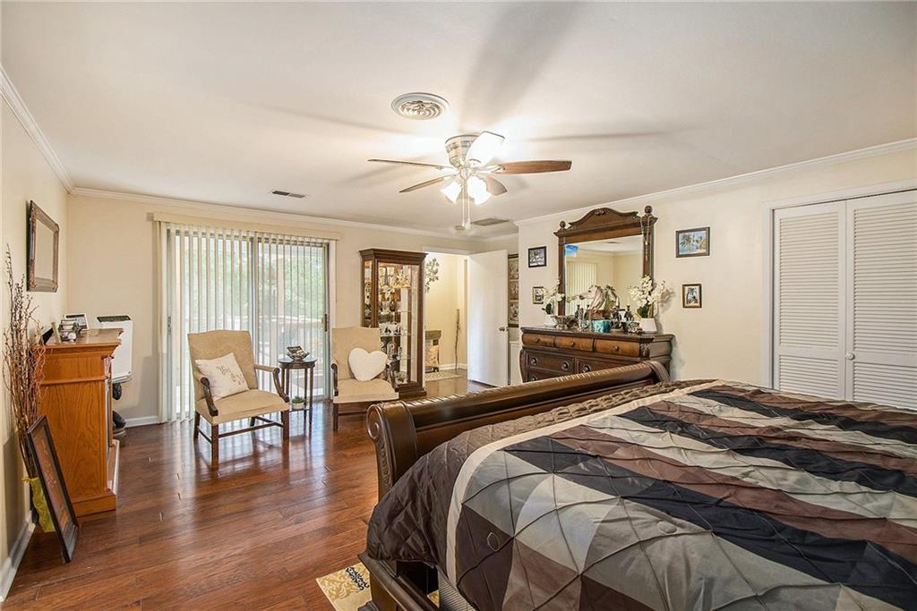 111 Lewis Drive Southeast Calhoun, GA 30701 - Photo 28 of 53 a bedroom with a bed and large windows