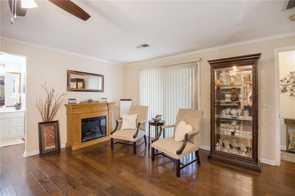 111 Lewis Drive Southeast Calhoun, GA 30701 - Photo 30 of 53 a living room with furniture and a fireplace