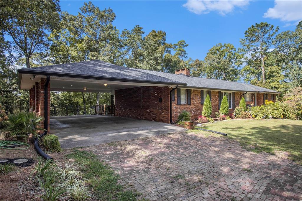 111 Lewis Drive Southeast Calhoun, GA 30701 - Photo 49 of 53 a view of a house with backyard and sitting area