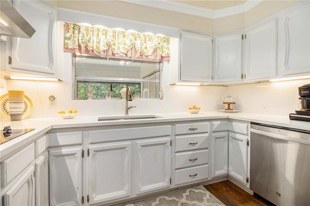 111 Lewis Drive Southeast Calhoun, GA 30701 - Photo 8 of 53 a kitchen with cabinets appliances a sink and a window