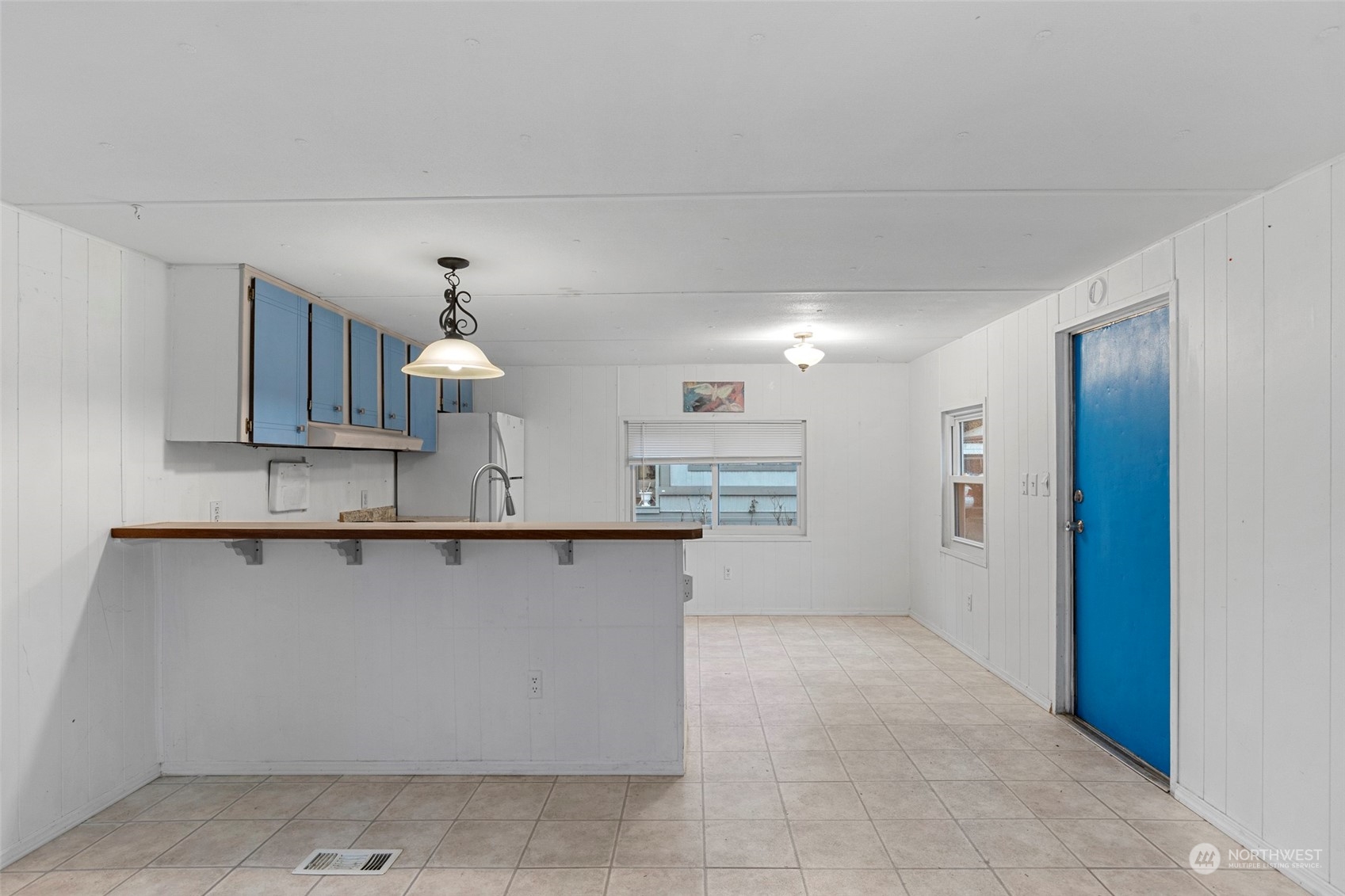 2522 Old Highway 99 South Road, Unit 23 Mount Vernon, WA 98273 - Photo 11 of 22 a view of a kitchen with wooden cabinets and a sink