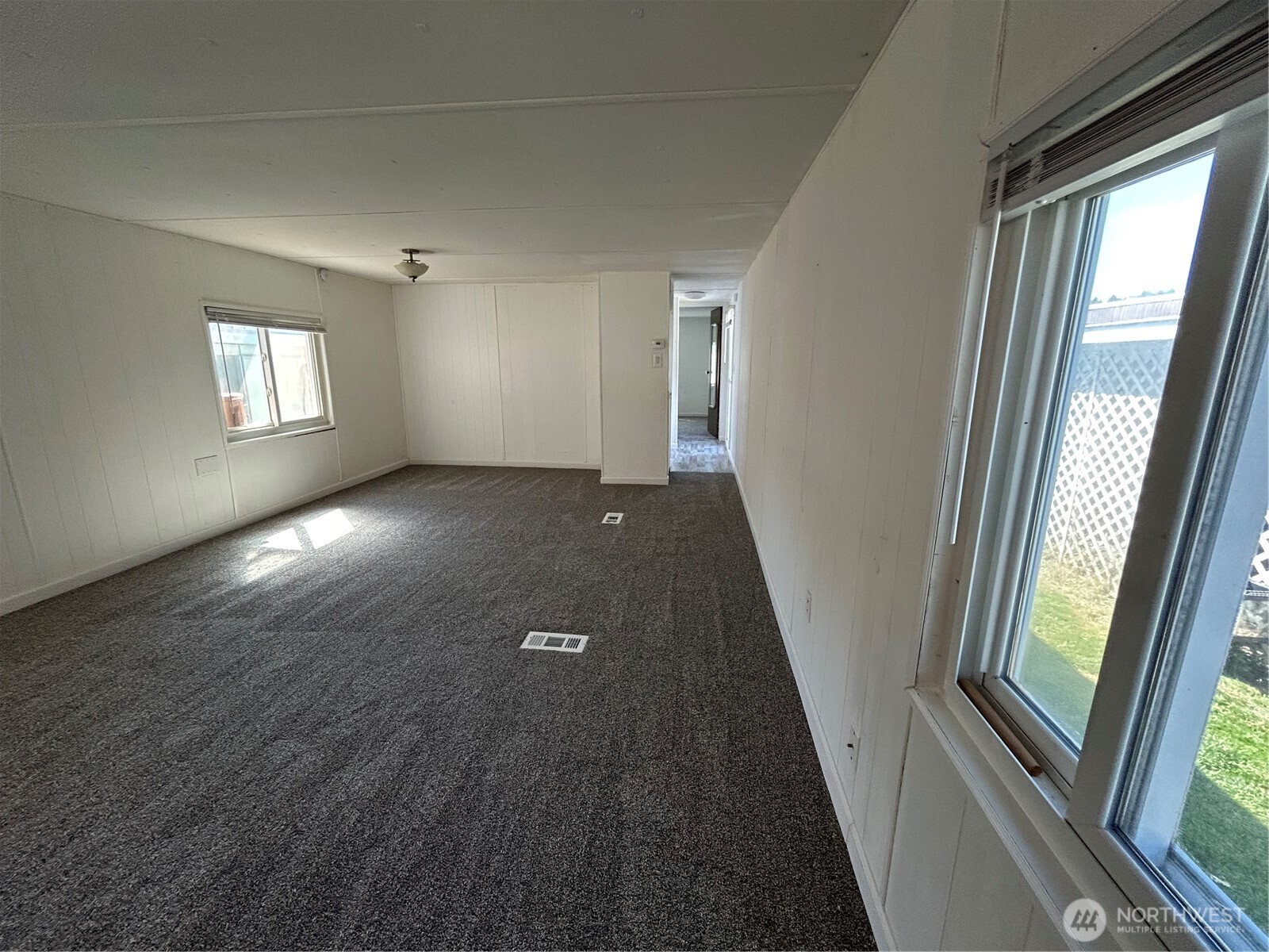 2522 Old Highway 99 South Road, Unit 23 Mount Vernon, WA 98273 - Photo 15 of 22 wooden floor in an empty room with a window