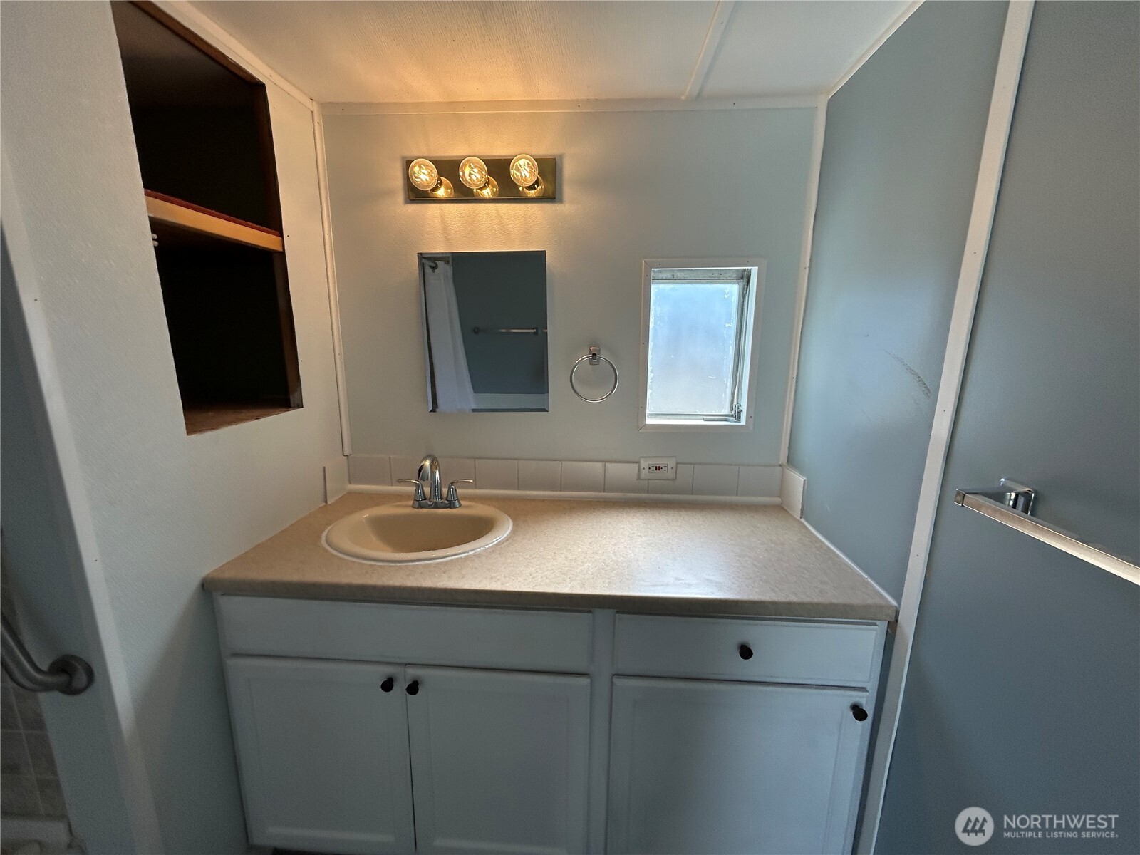 2522 Old Highway 99 South Road, Unit 23 Mount Vernon, WA 98273 - Photo 16 of 22 a bathroom with a sink and a mirror