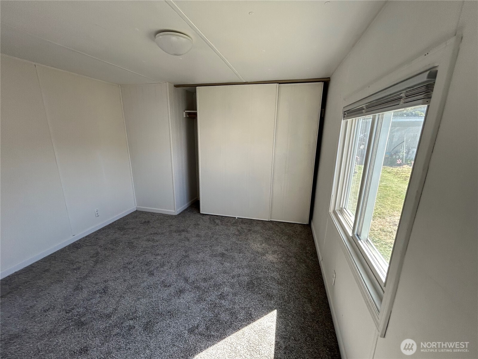 2522 Old Highway 99 South Road, Unit 23 Mount Vernon, WA 98273 - Photo 20 of 22 wooden floor in an empty room with a window