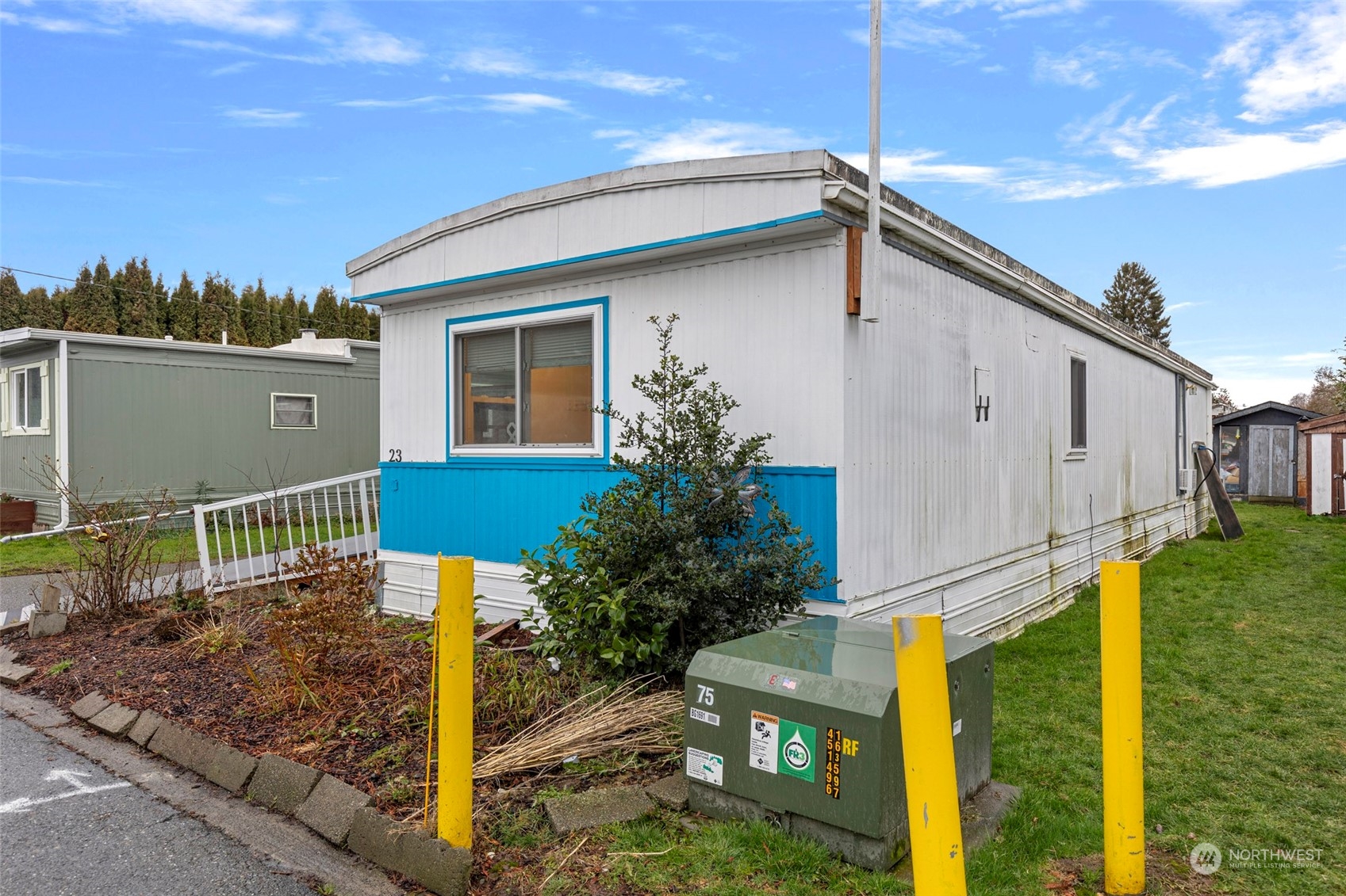 2522 Old Highway 99 South Road, Unit 23 Mount Vernon, WA 98273 - Photo 2 of 22 a front view of a house with garden