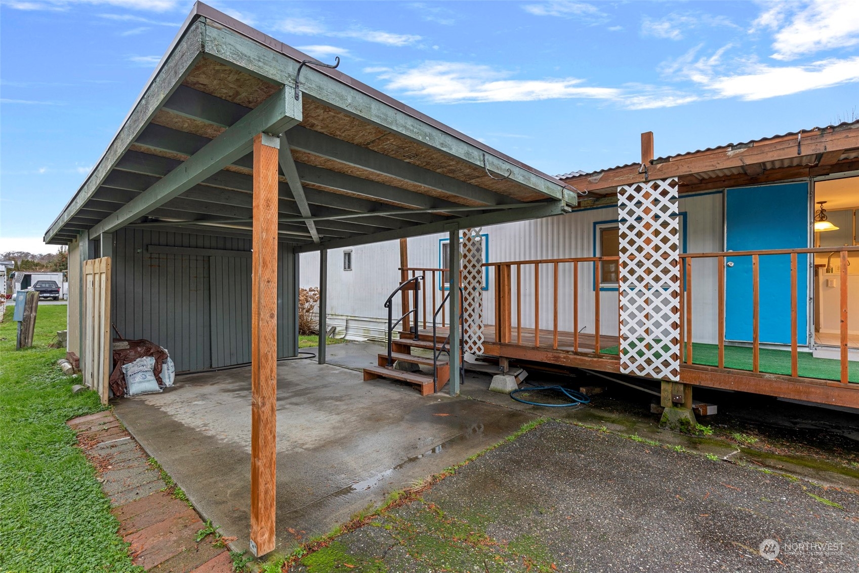2522 Old Highway 99 South Road, Unit 23 Mount Vernon, WA 98273 - Photo 4 of 22 a backyard of a house with barbeque oven table and chairs