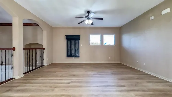 a view of room with window and hardwood floor