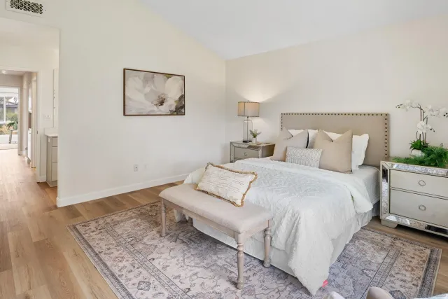 a bedroom with a bed and a couch