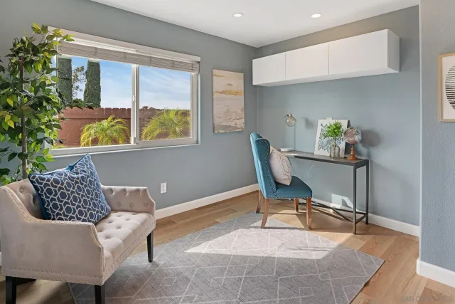 a living room with furniture and a window