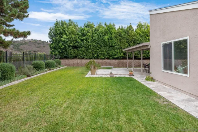 a view of a backyard with a garden and plants