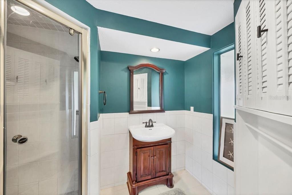 4696 Pompano Street Placida, FL 33946 - Photo 14 of 23 a bathroom with a sink and a mirror