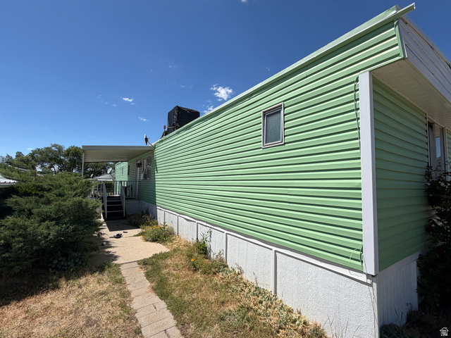 335 Hillgate Way Layton, UT 84041 - Photo 2 of 5 Light green horizontal siding with white trim