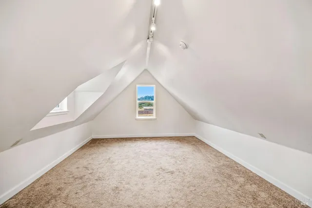 a view of an empty room with white walls