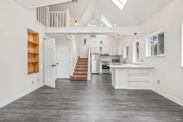 a view of kitchen and dining room with wooden floor