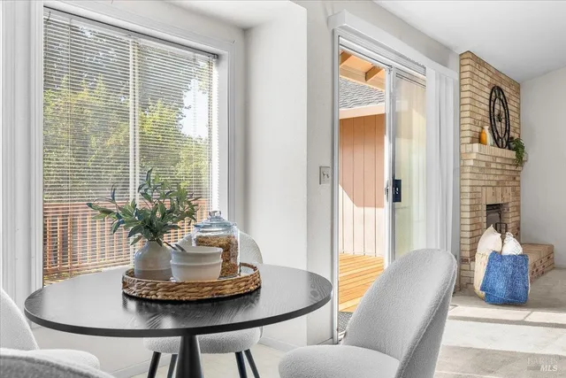 a dining room with furniture and window