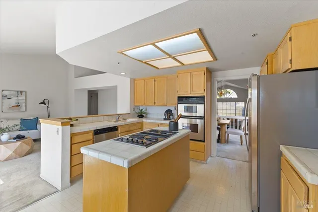 a kitchen that has a stove and a refrigerator