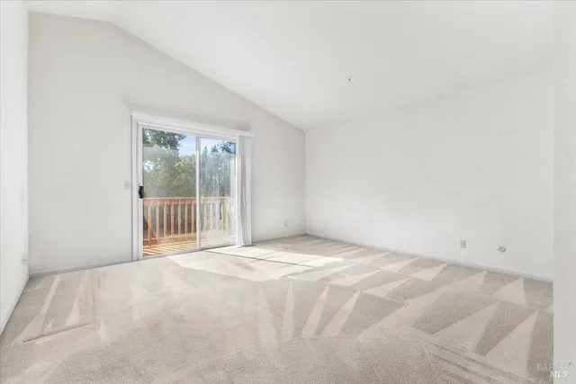 a view of an empty room with a balcony