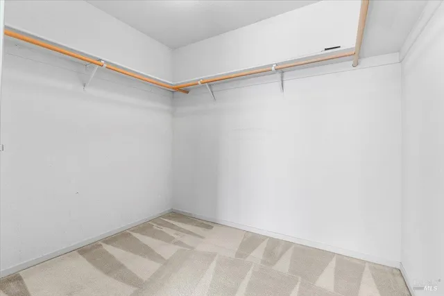 a view of a room with racks on the wall