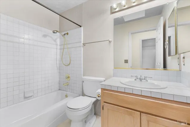 a bathroom with a sink a toilet and a bathtub