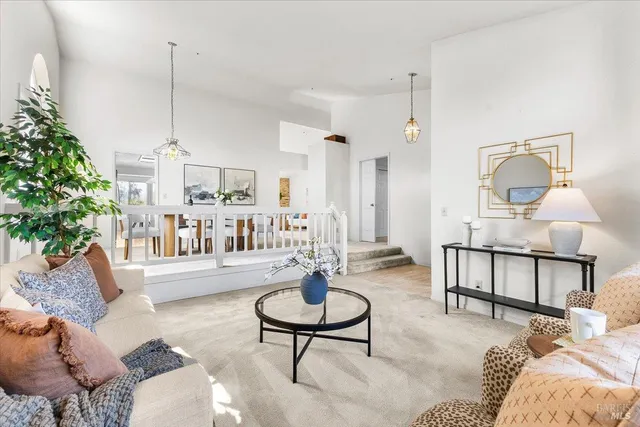 a living room with furniture a window and a table