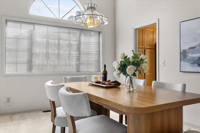 a dining room with furniture and wooden floor