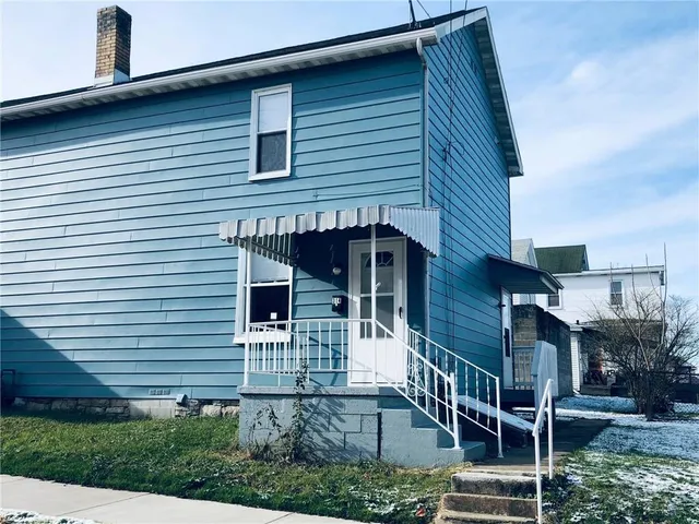 a front view of a house with garage
