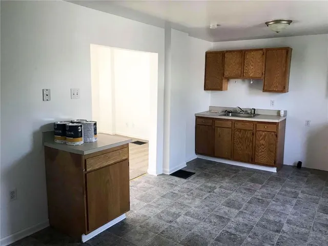 a kitchen with a stove and a refrigerator
