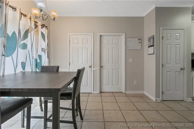 a view of a dining room with a table and chairs